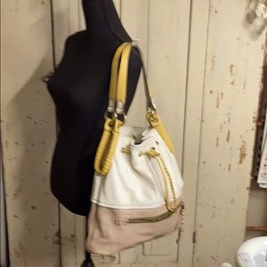 OrYany shoulder draw string white handbag.